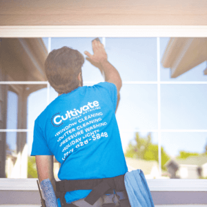 a man cleaning a window