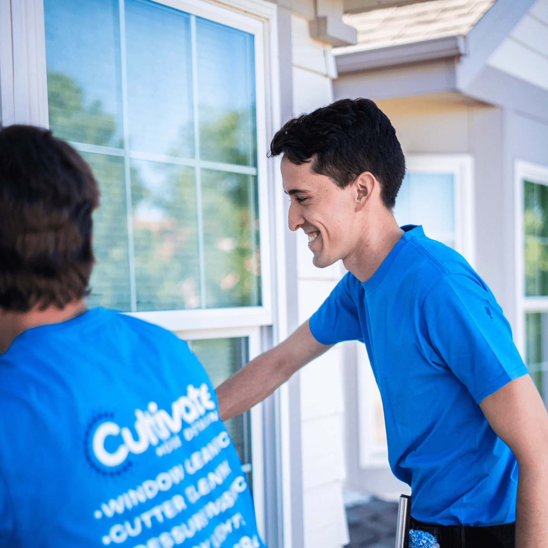 a picture of the cultivate house detailing team washing windows